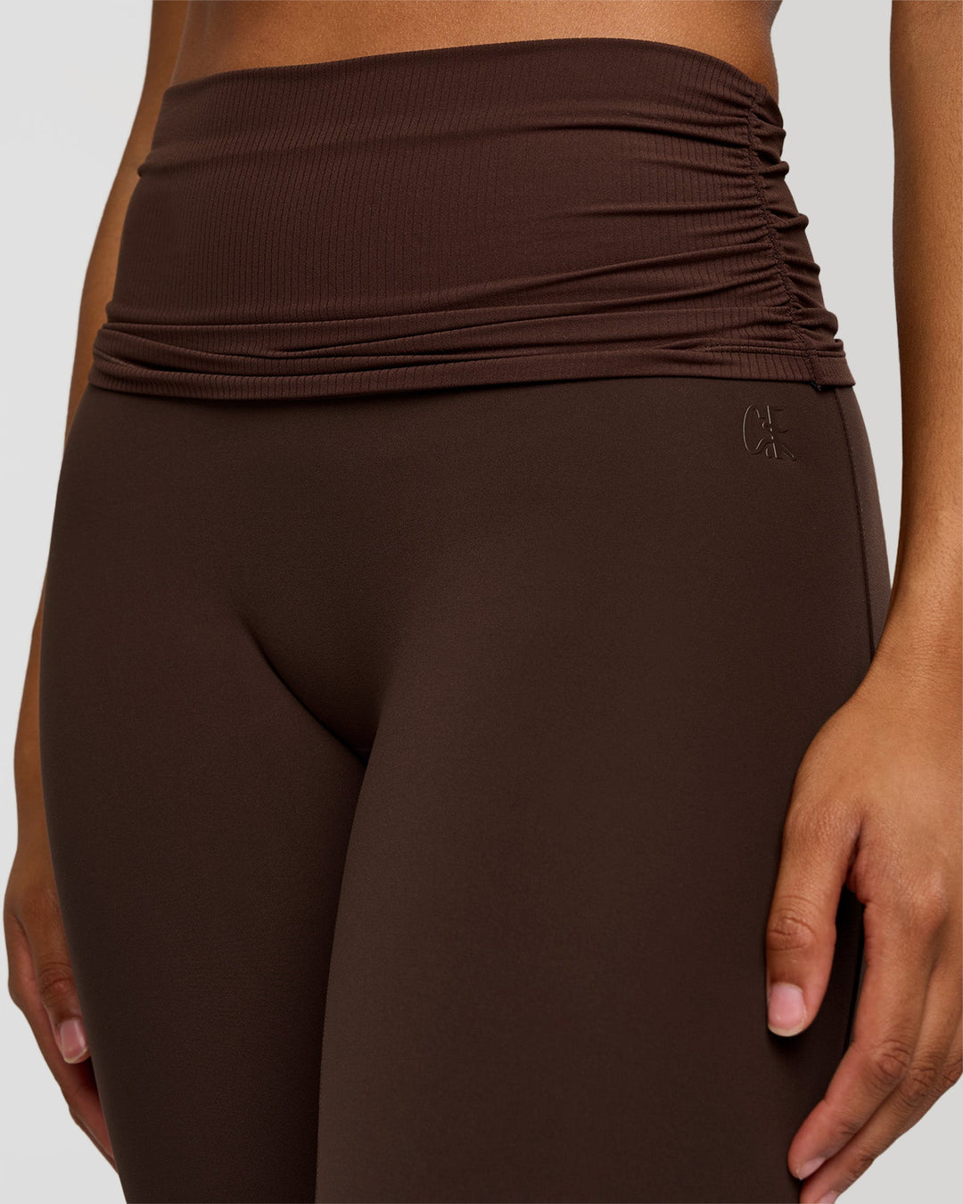 Woman wearing CF Fold Over High-Rise Flared Legging Tall - Hot Chocolate | Model:Rosie | Size:S