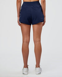 Woman wearing Challenger 3" Lined Performance Short - Future Navy | Model:Evie | Size:S