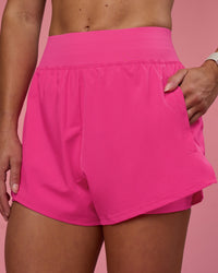 Woman wearing Challenger 3" Lined Performance Short - Ultra Pink | Model:Hannah | Size:S