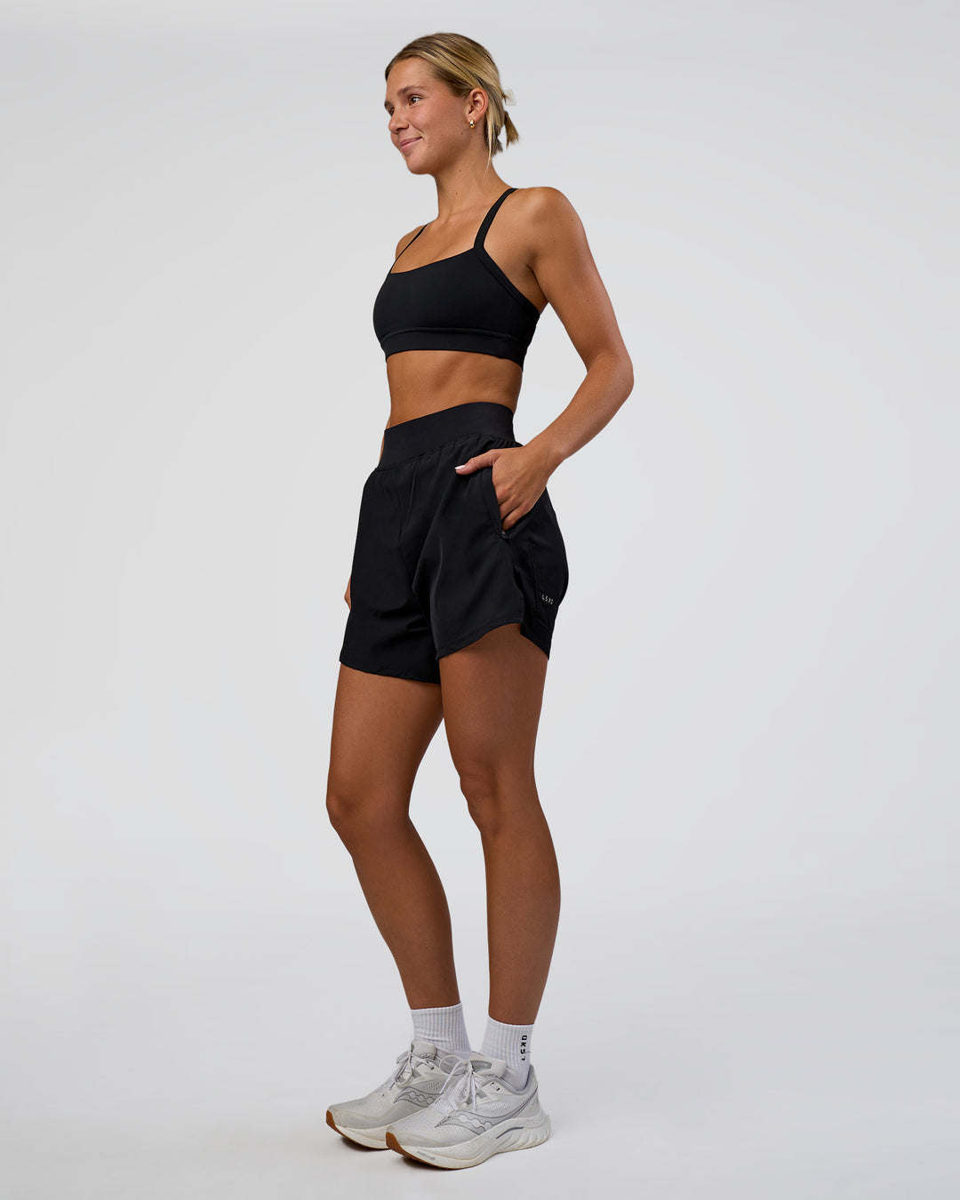 Woman wearing Challenger 5&quot; Lined Performance Short - Black | Model:Amity | Size:S