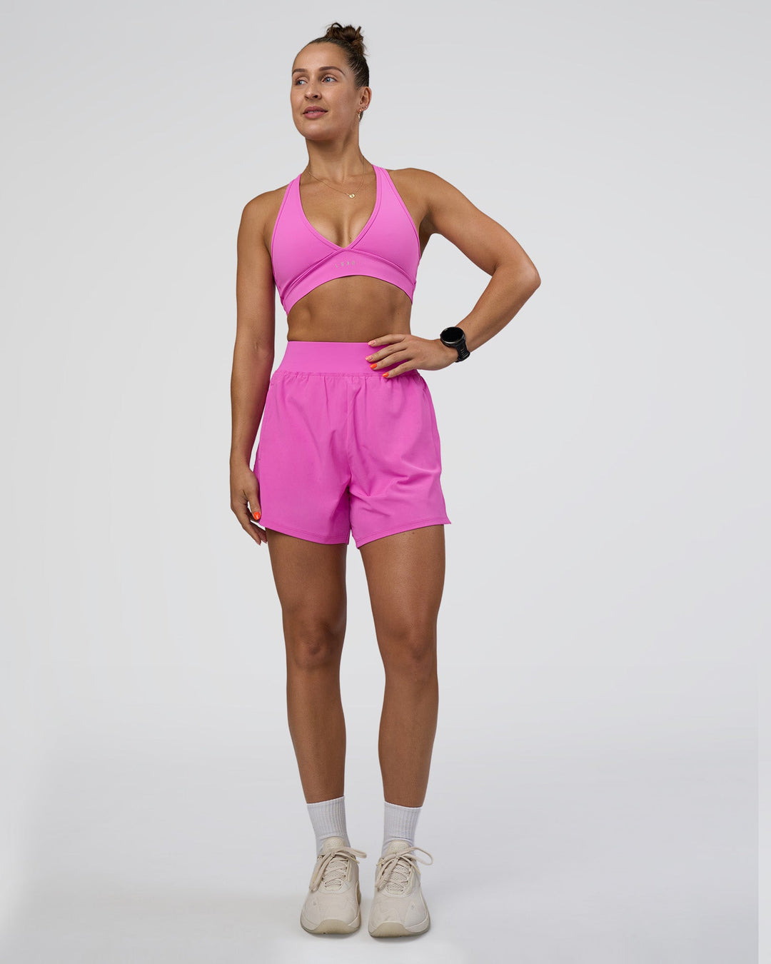 Woman wearing Challenger 5&quot; Lined Performance Short - Ultra Fuchsia | Model:Abbey | Size:S