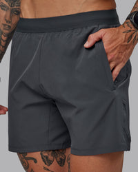 Man wearing Challenger 6" Performance Short in Dark Storm | Size:S