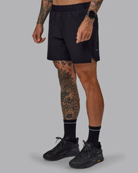 Man wearing Challenger 6" Performance Shorts in Black | Size:S