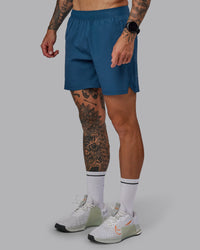 Man wearing Challenger 6" Performance Short in Indigo | Size:S