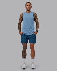 Man wearing Challenger 6" Performance Short in Indigo | Size:S