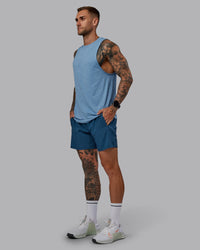 Man wearing Challenger 6" Performance Short in Indigo | Size:S