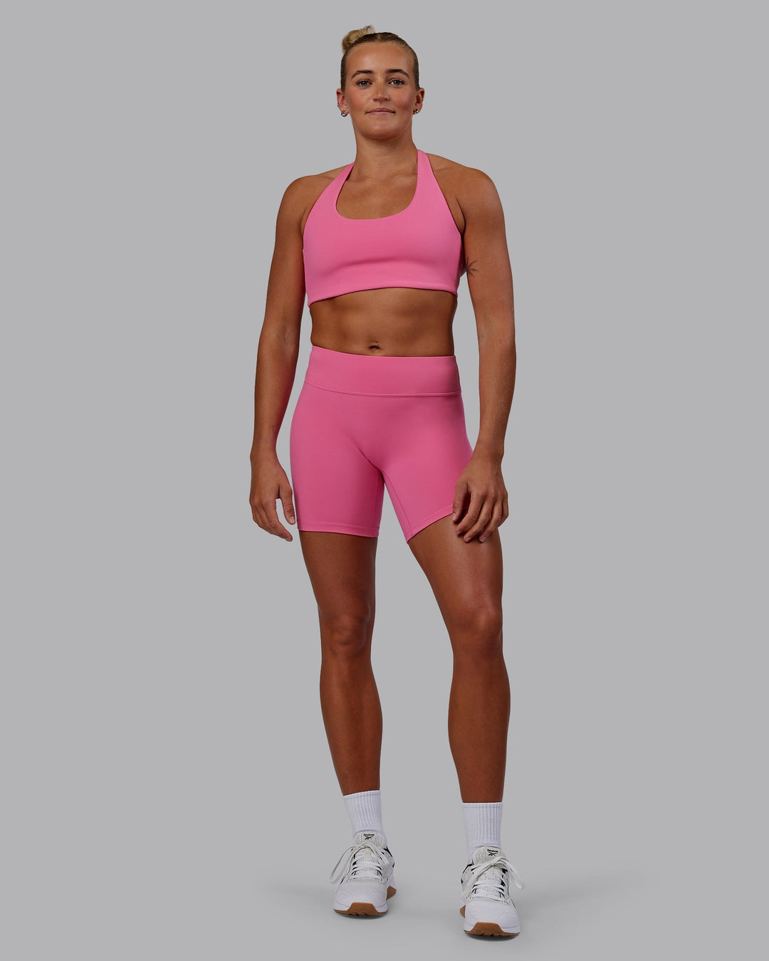 Woman wearing Challenger Sports Bra - Carmine Rose