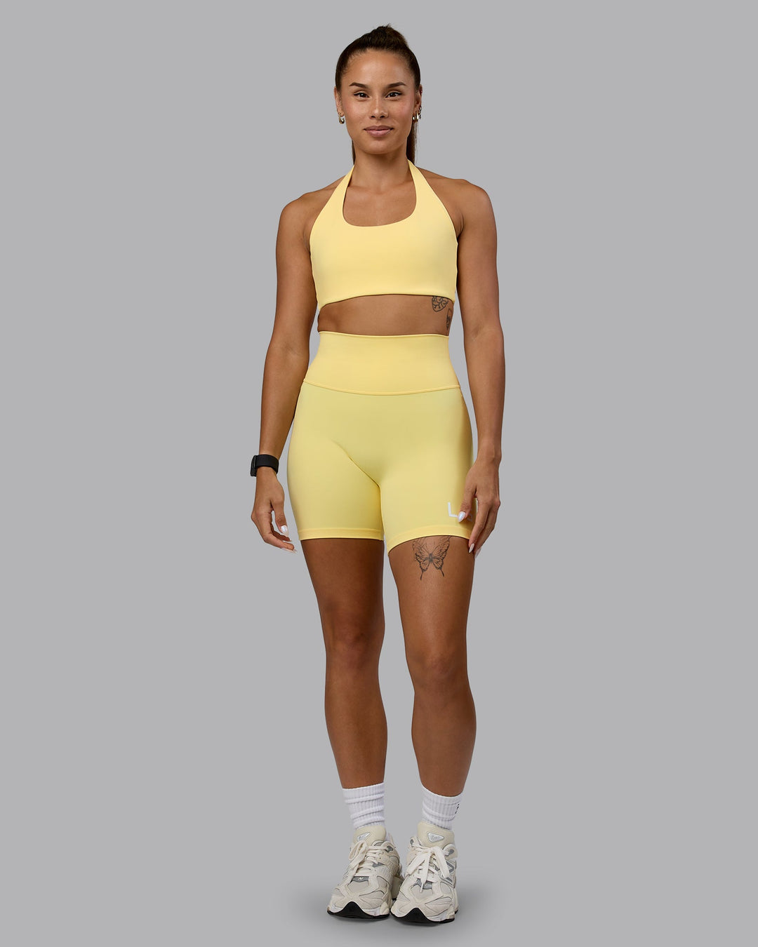 Woman wearing Challenger Sports Bra - Lemon