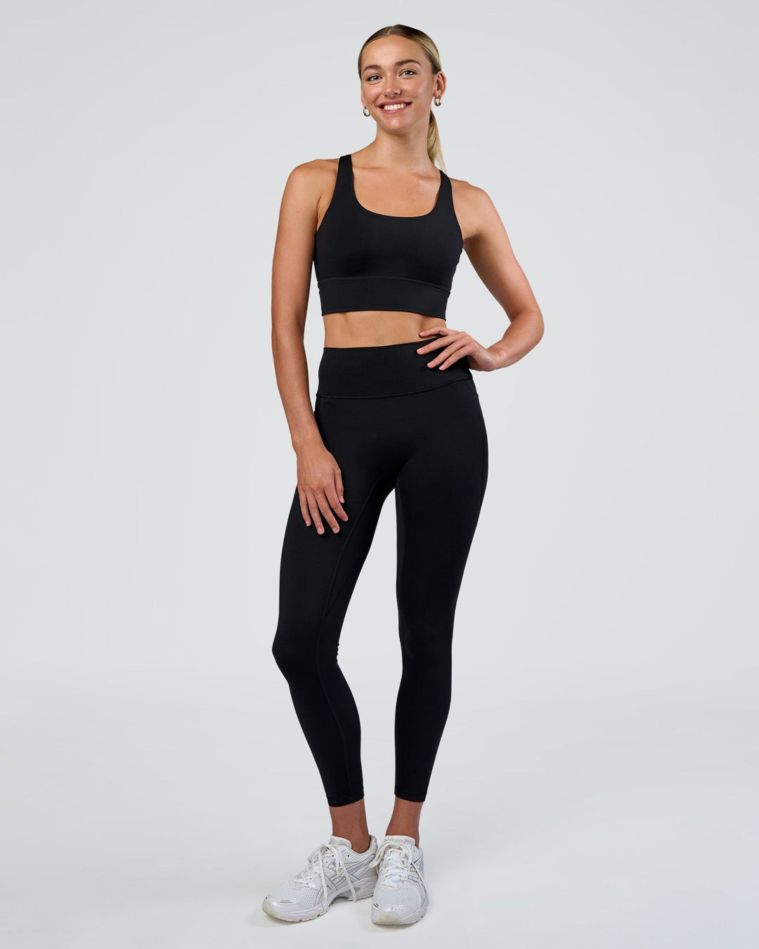 Woman wearing Circuit Longline Sports Bra - Black | Model:Evie | Size:S - view 3