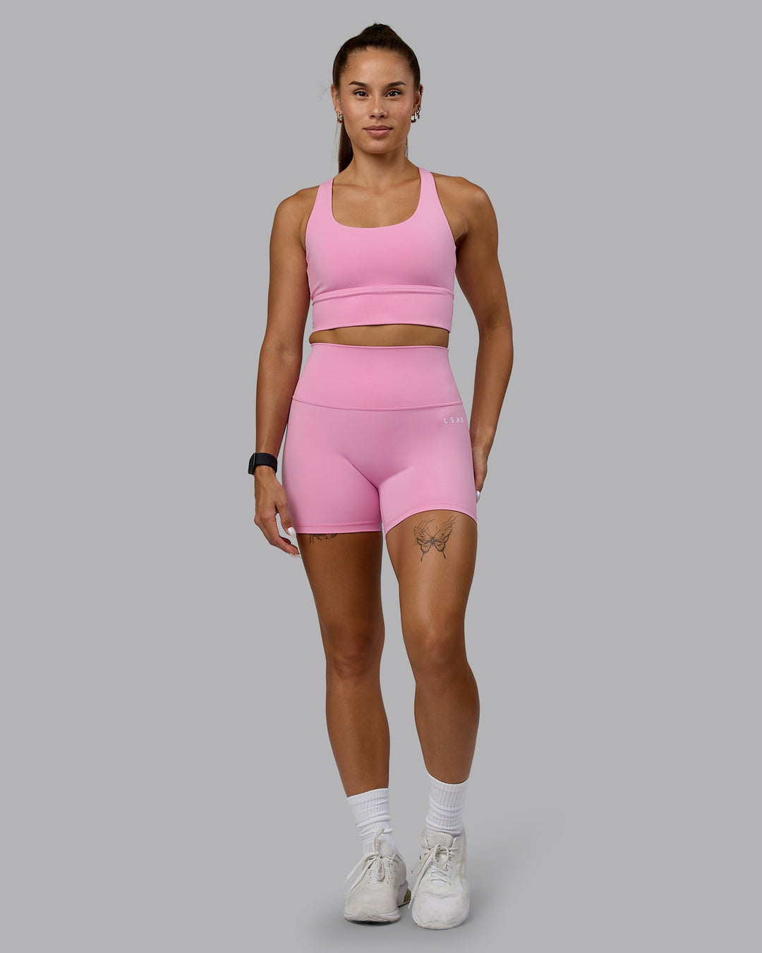 Woman wearing Circuit Sports Bra - Bubblegum