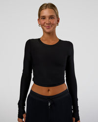 Woman wearing Clarity Long Sleeve Tee - Black | Model:Amity | Size:S