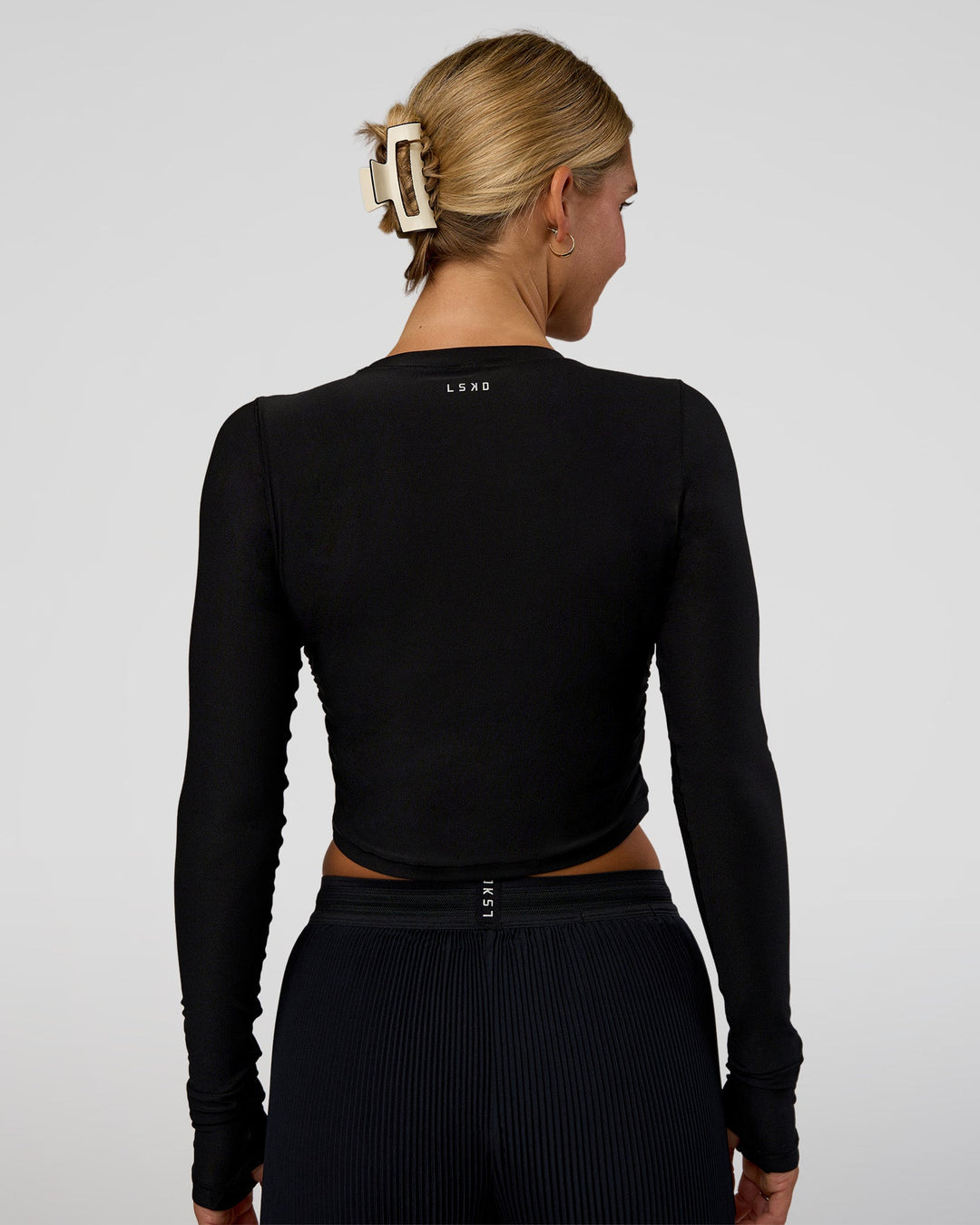 Woman wearing Clarity Long Sleeve Tee - Black | Model:Amity | Size:S