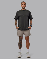 Man wearing Daily 5" Shorts - Shale Beige