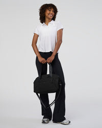 Woman wearing Drive Polo - White | Model:Tomi | Size:S