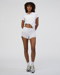 Woman wearing Drive Polo - White | Model:Tomi | Size:S