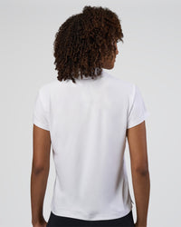 Woman wearing Drive Polo - White | Model:Tomi | Size:S