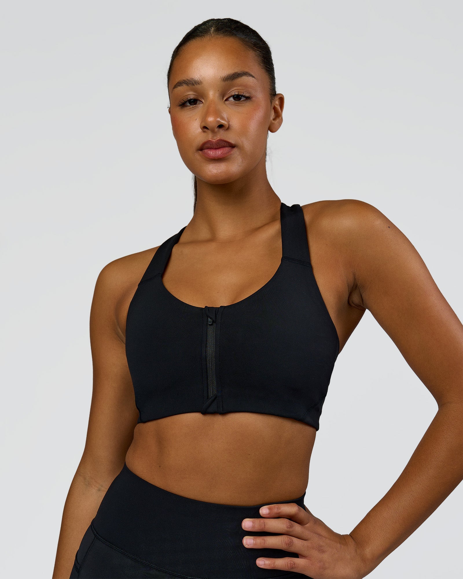 Woman wearing Elarra Zip Front Sports Bra - Black | Model:Rosie | Size:S