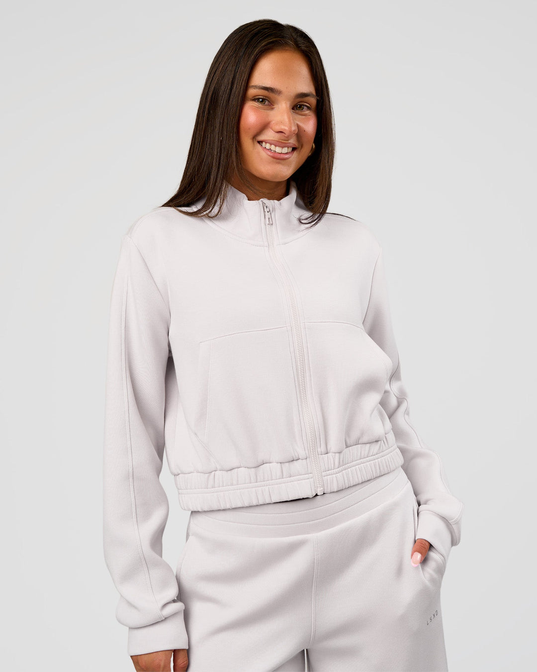 Woman wearing Elevate SoftTouch Cropped Full Zip Jacket - Clay | Model:Bianca | Size:S