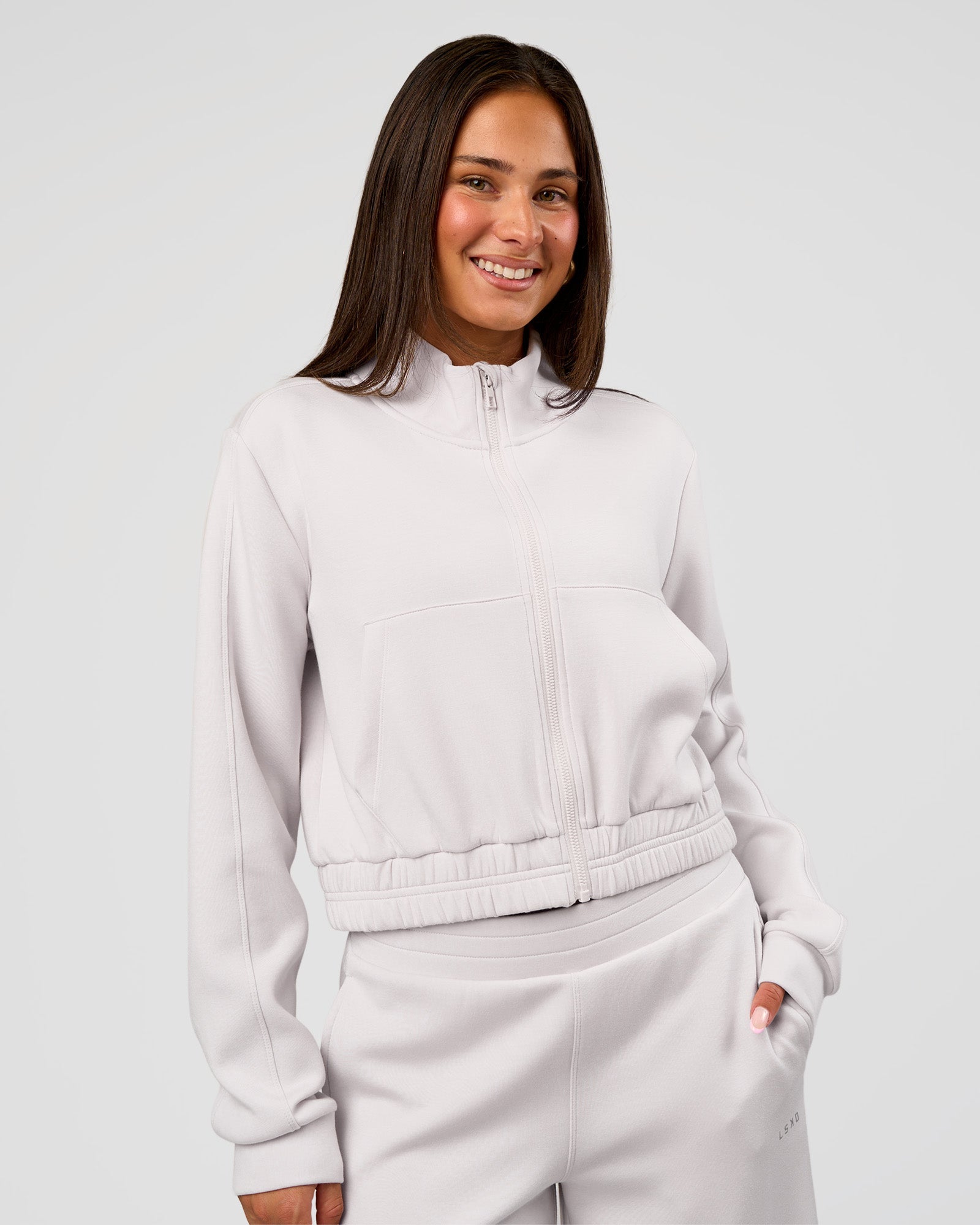 Woman wearing Elevate SoftTouch Cropped Full Zip Jacket - Clay | Model:Bianca | Size:S