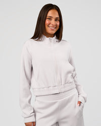 Woman wearing Elevate SoftTouch Cropped Full Zip Jacket - Clay | Model:Bianca | Size:S