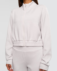 Woman wearing Elevate SoftTouch Cropped Full Zip Jacket - Clay | Model:Bianca | Size:S