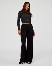 Woman wearing Elevate SoftTouch Wide Leg Pant Tall - Black | Model:Bianca | Size:S