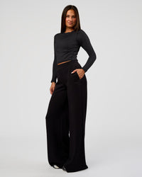 Woman wearing Elevate SoftTouch Wide Leg Pant Tall - Black | Model:Bianca | Size:S