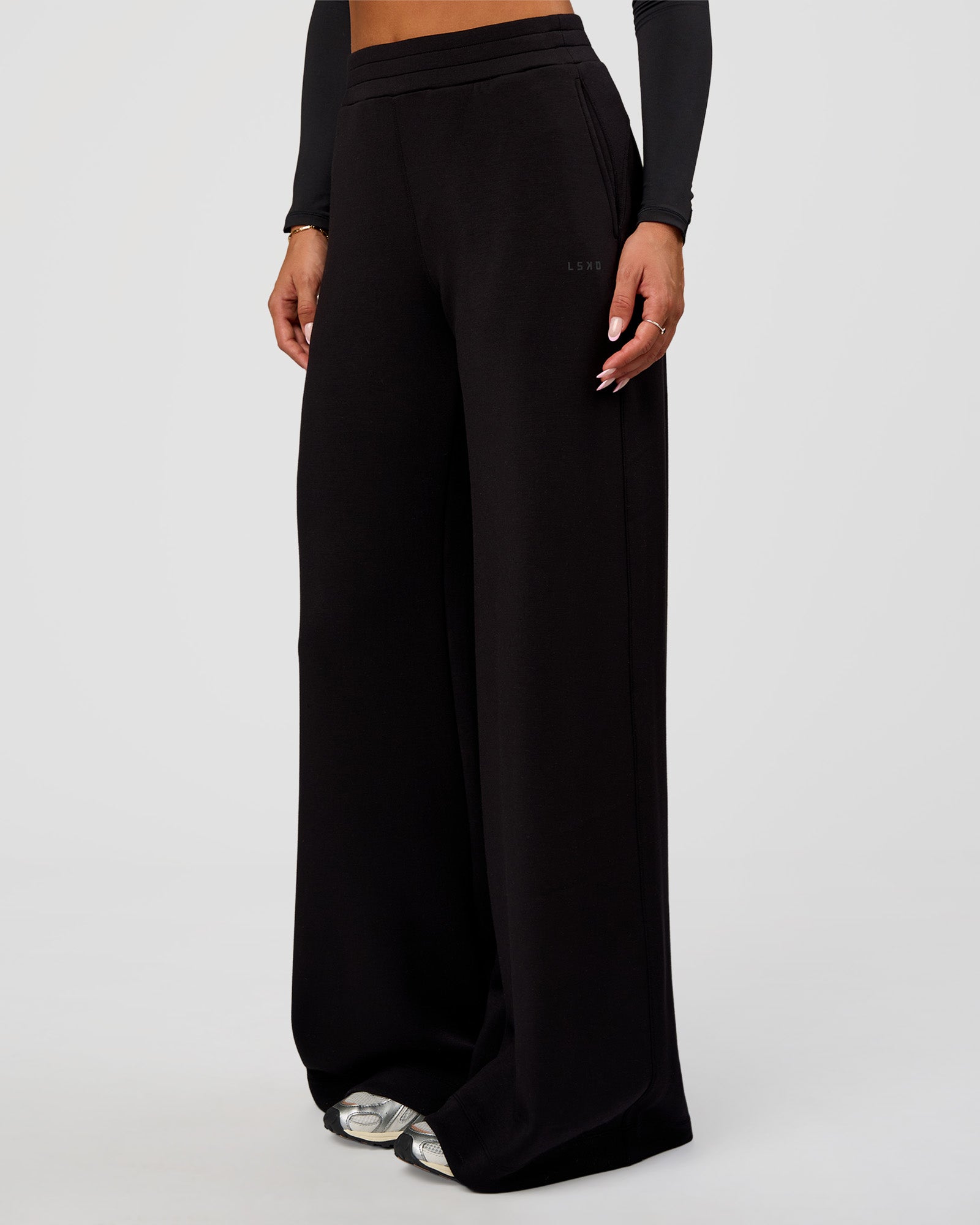 Woman wearing Elevate SoftTouch Wide Leg Pant Tall - Black | Model:Bianca | Size:S
