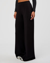 Woman wearing Elevate SoftTouch Wide Leg Pant Tall - Black | Model:Bianca | Size:S