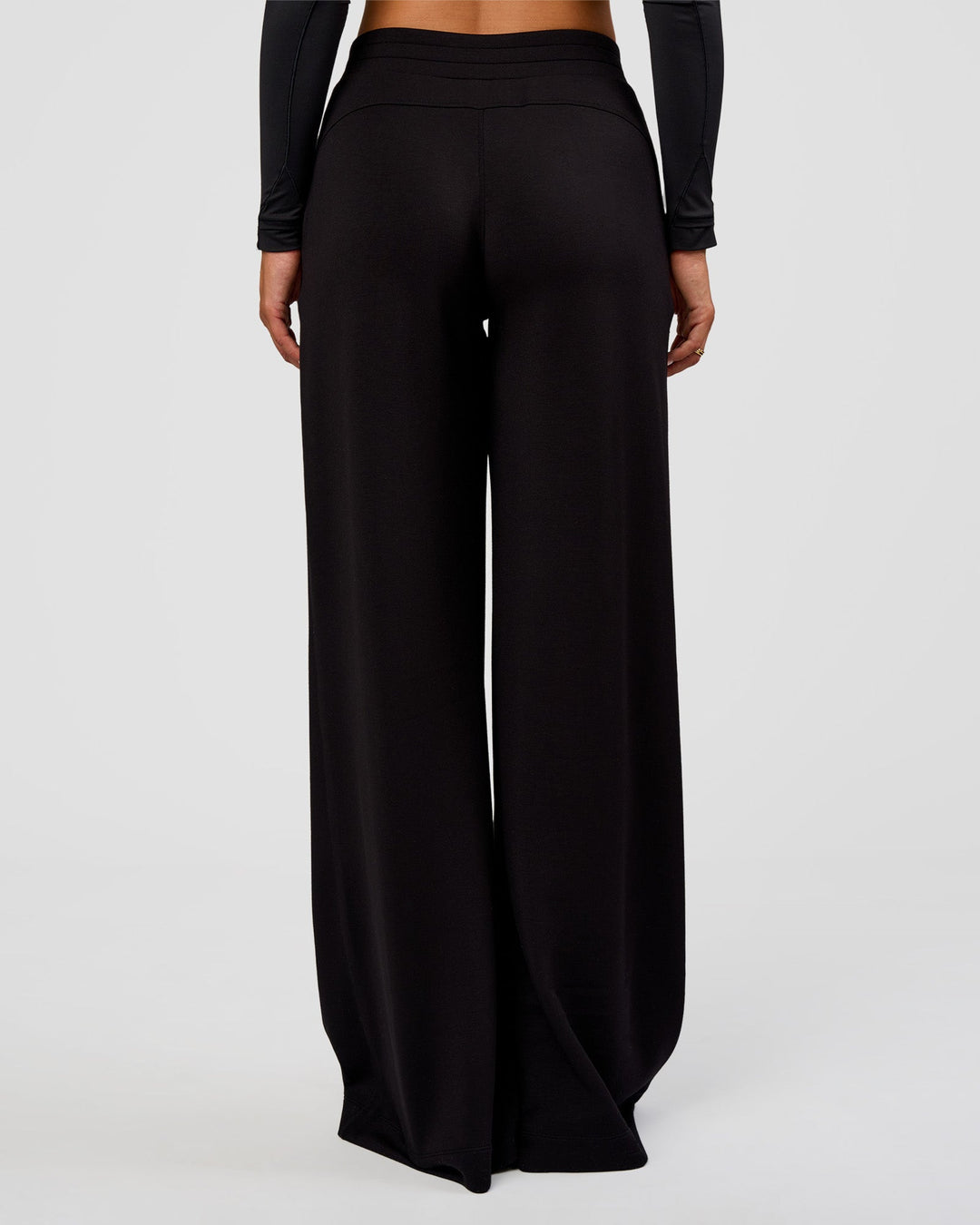 Woman wearing Elevate SoftTouch Wide Leg Pant Tall - Black | Model:Bianca | Size:S