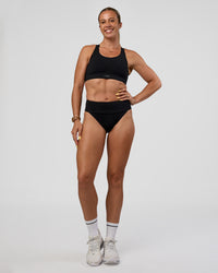 Woman wearing Elevate Sprinting Brief - Black | Model:Bree | Size:S
