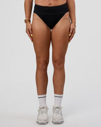 Woman wearing Elevate Sprinting Brief - Black | Model:Bree | Size:S