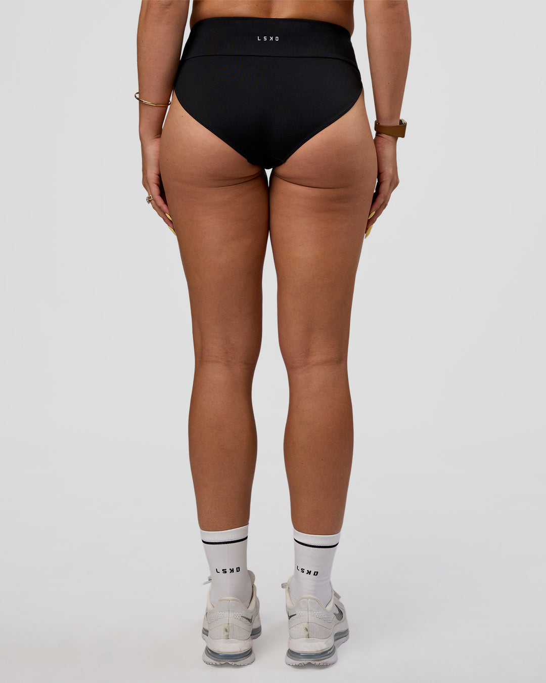 Woman wearing Elevate Sprinting Brief - Black | Model:Bree | Size:S