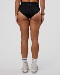 Woman wearing Elevate Sprinting Brief - Black | Model:Bree | Size:S