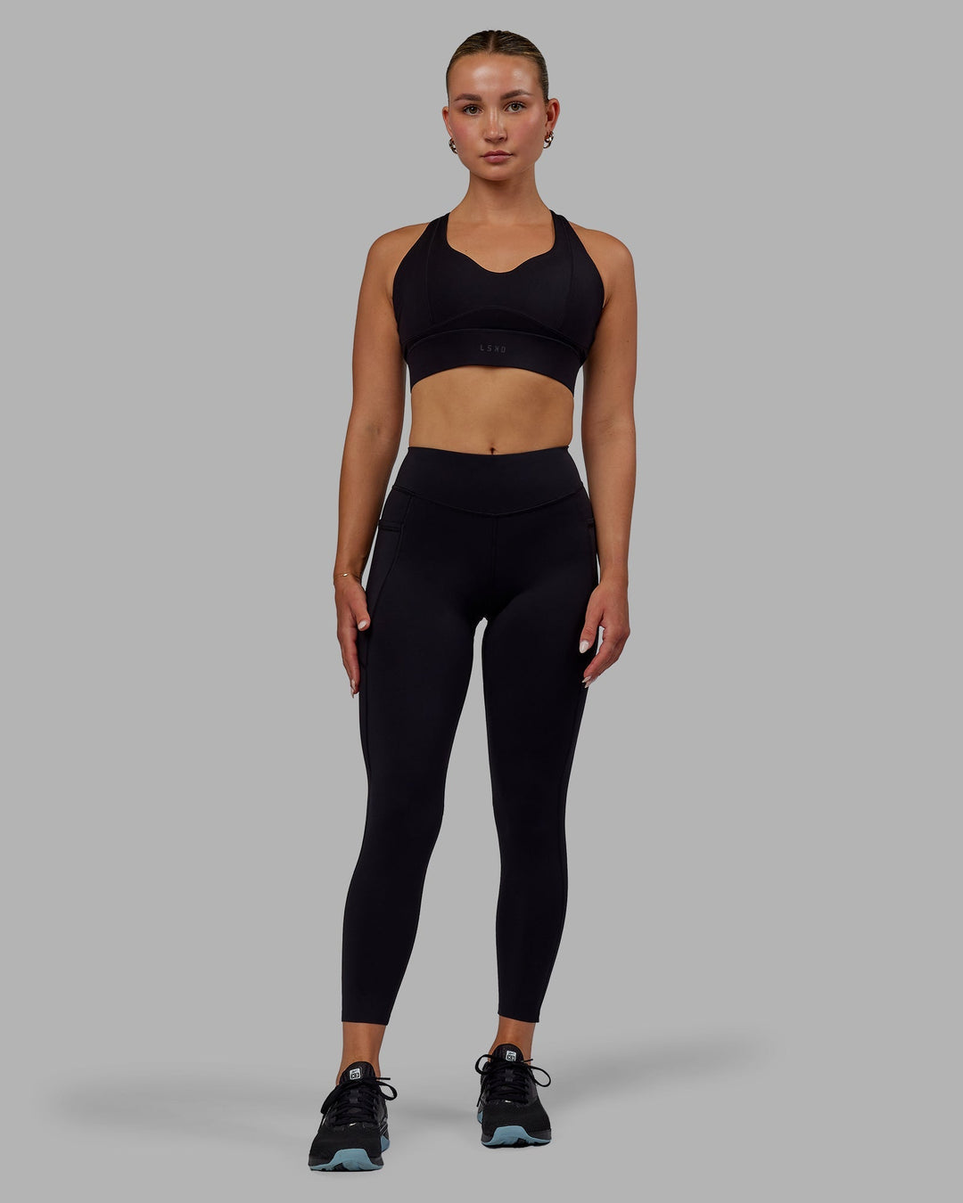 Woman wearing Elite 7/8 Length Leggings - Black