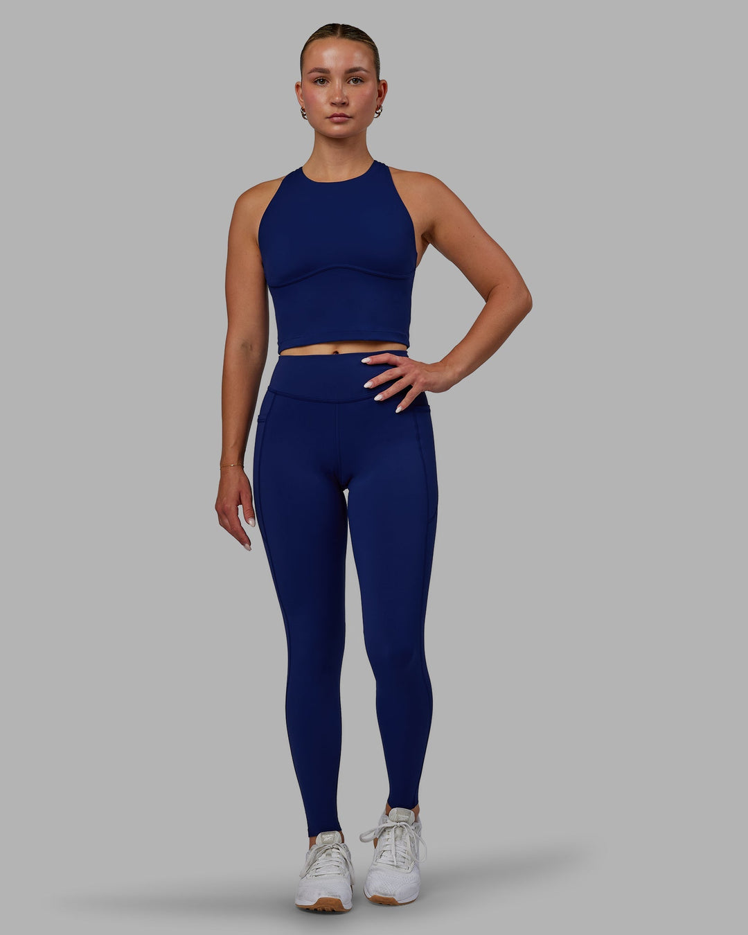 Woman wearing Elite Full Length Leggings - Midnight Blue