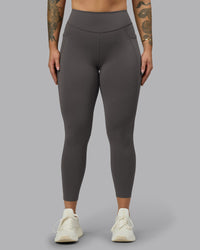 Woman wearing Elite High-Rise 7/8 Legging Pockets - Dark Storm | Model:Robyn | Size:S