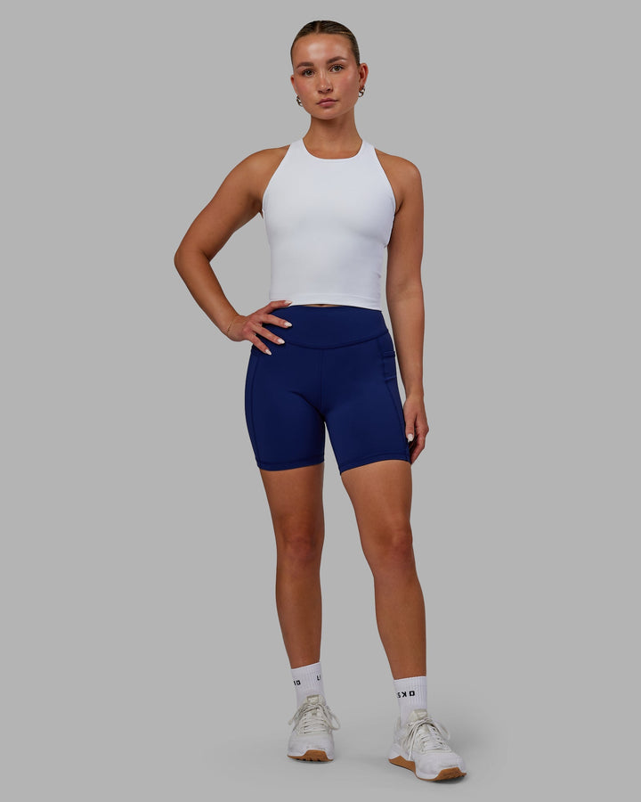 Woman wearing Elite Mid-Length Shorts - Midnight Blue
