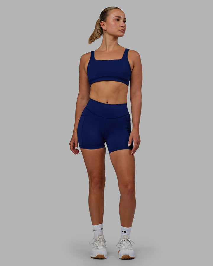 Woman wearing Elite X-Length Shorts - Midnight Blue
