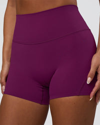 Woman wearing Elixir Defined High-Rise 4" Short - Plum Caspia | Model:Bianca | Size:S