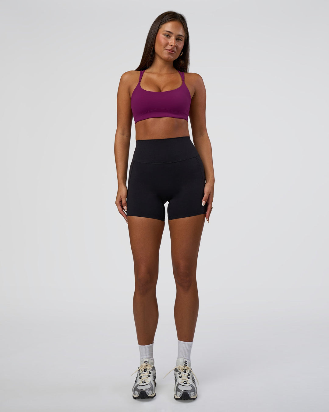 Woman wearing Elixir Defined High-Rise 6&quot; Short Pockets - Black | Model:Bianca | Size:S