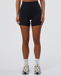 Woman wearing Elixir Defined High-Rise 6" Short Pockets - Black | Model:Bianca | Size:S