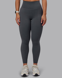 Woman wearing Elixir Ultra High-Rise Full Length Leggings in Dark Storm | Size:S