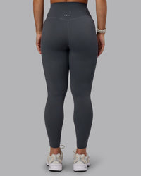Woman wearing Elixir Ultra High-Rise Full Length Leggings in Dark Storm | Size:S