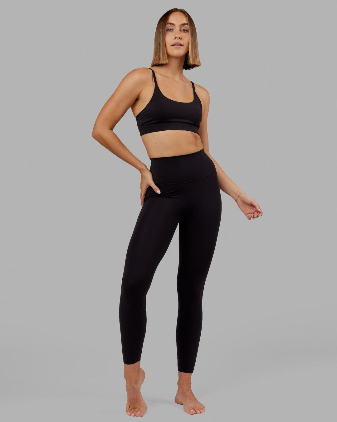 Woman wearing Elixir Full Length Tight - Black No Logo