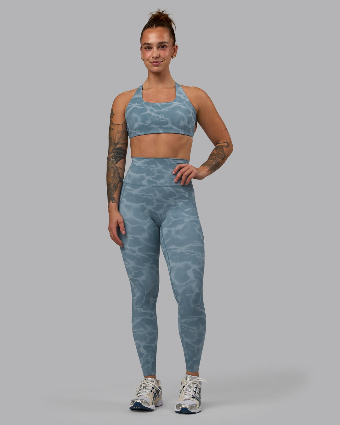 Woman wearing Elixir Full Length Leggings With Pockets - Tranquil-Elemental Blue