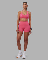 Woman wearing Elixir High-Rise 4" Short - Hot Pink | Model:Rhiley | Size:S