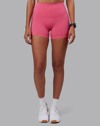 Woman wearing Elixir High-Rise 4" Short - Hot Pink | Model:Rhiley | Size:S