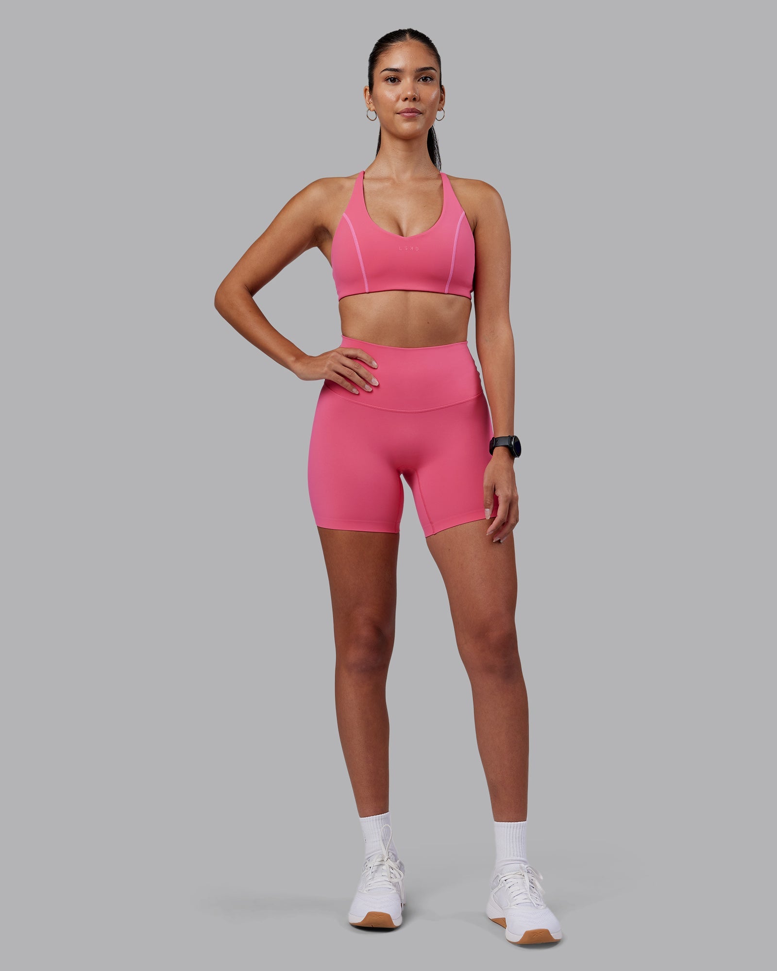 Woman wearing Elixir High-Rise 6" Short - Hot Pink | Model:Rhiley | Size:S