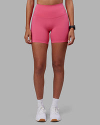 Woman wearing Elixir High-Rise 6" Short - Hot Pink | Model:Rhiley | Size:S